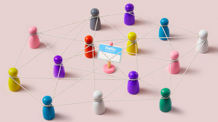 Most common names in the US from the 2020 Census, small wooden peg dolls connected with twine