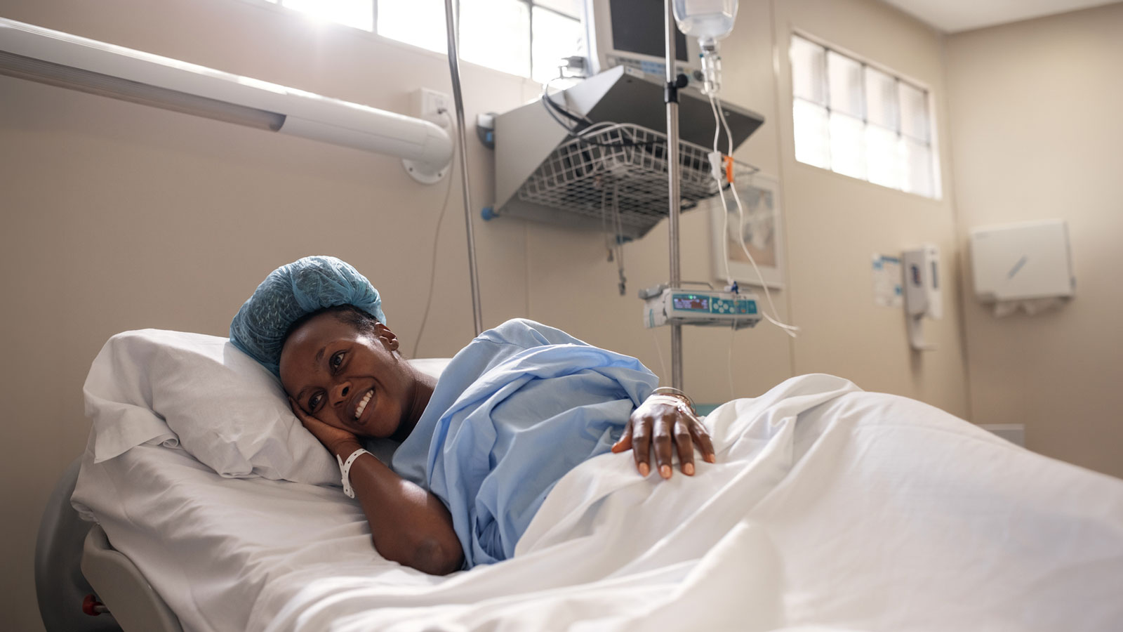 Pitocin induction, smiling pregnant woman with IV in labor room