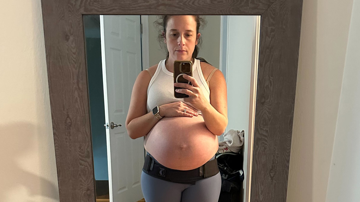Pregnant woman wearing the Serola Belt. 